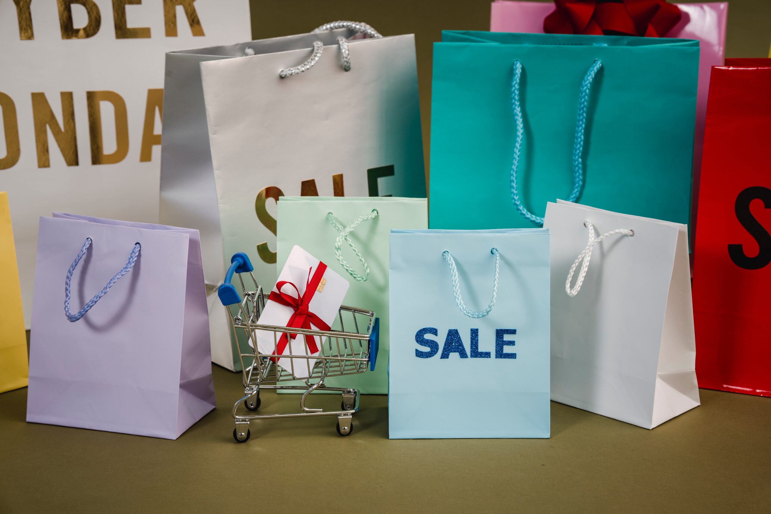 Shopping bags with sale written on them